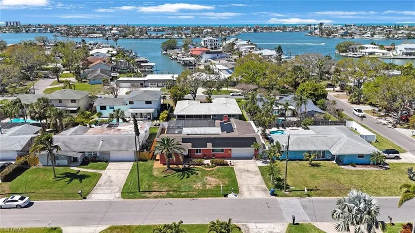Aerial view featuring a residential view and a water view