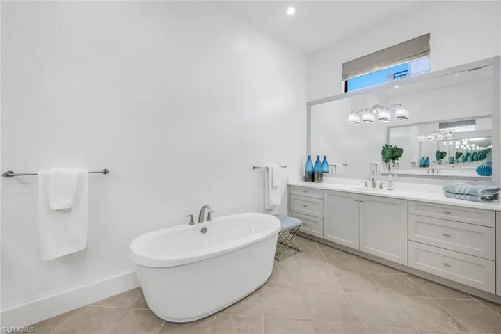 Primary soaking tub 1 of 2 vanities