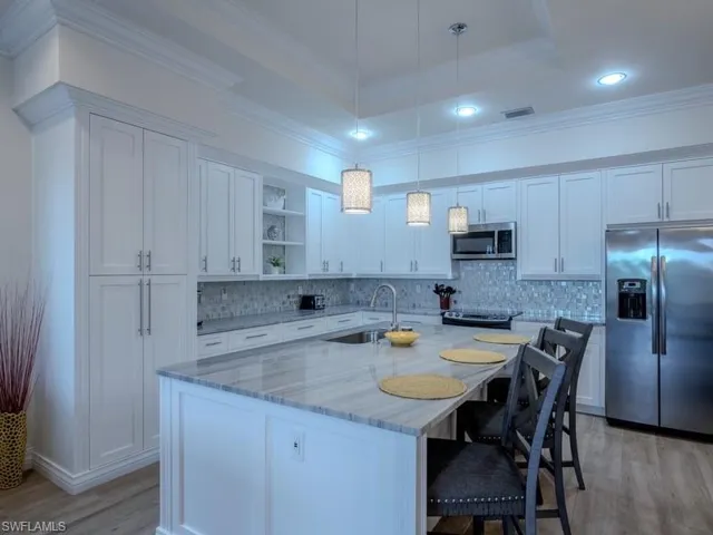 Extended Cabinetry with Custom Wood Trim Throughout