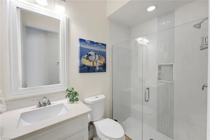 Secondary Bathroom with Quartz Counters and Glass Shower