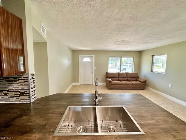 Enter front door to Living  room and kitchen