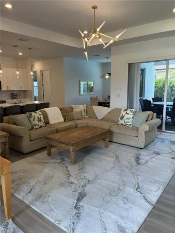 Open-concept living area with wood-finish flooring