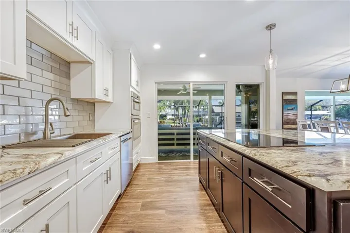 Kitchen with Natural Light, 2-Tone Cabinets, Large Quartz Island
