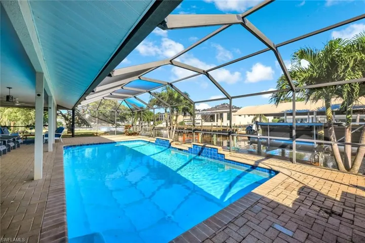 Heated Pool with Water Feature and Water Views