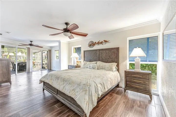 Primary Bedroom w/ Slider Doors and Water Views