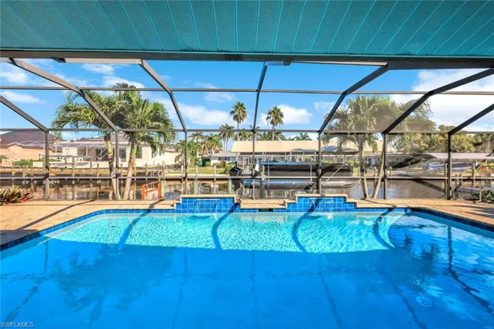 Heated Pool with Water Feature and Water Views