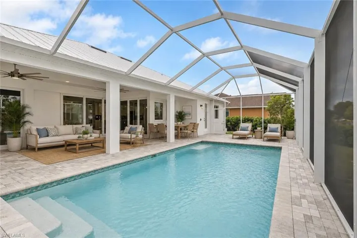 virtually staged, large 13' by 27' heated pool on 20' by 46" lanai