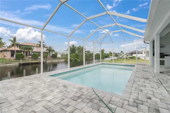 virtually staged, large 13' by 27' heated pool on 20' by 46" lanai