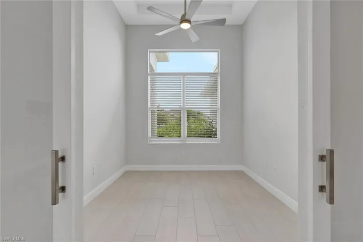 office/den with glass bar doors