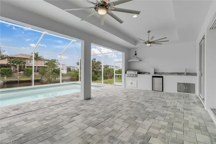 15' deep by 38' long under truss lanai with summer kitchen