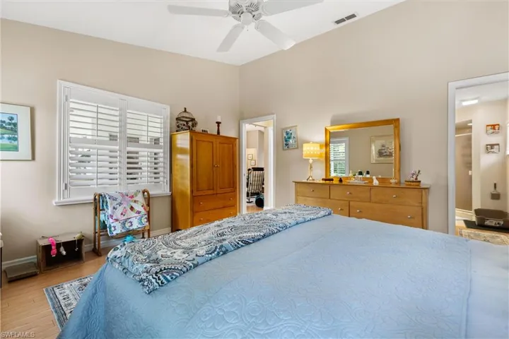 Bedroom with light hardwood / wood-style flooring and ceiling fan