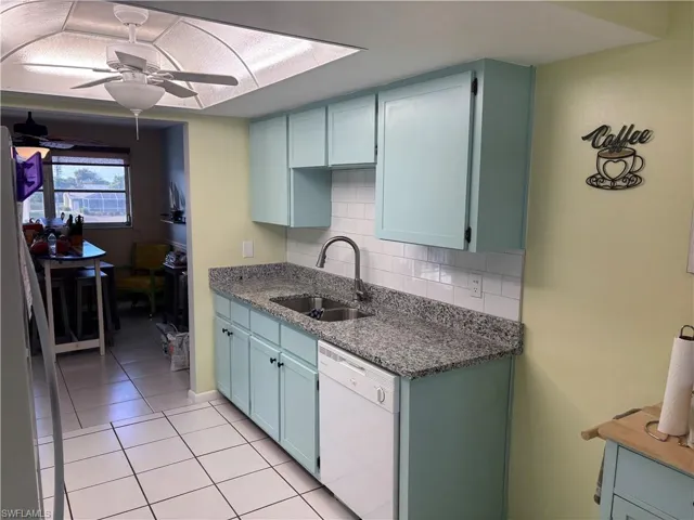 Newly refreshed kitchen with grantie tops and tile backsplash