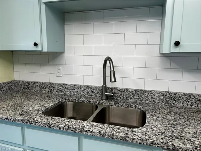 New Granite tops in kitchen, new faucet, new sink, new microwave, new tiled backsplash and new cabinet doors