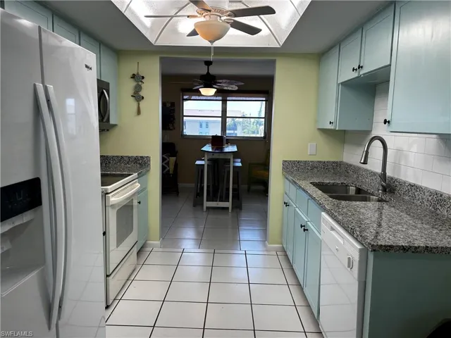 New Granite tops in kitchen, new faucet, new sink, new microwave, new tiled backsplash and new cabinet doors