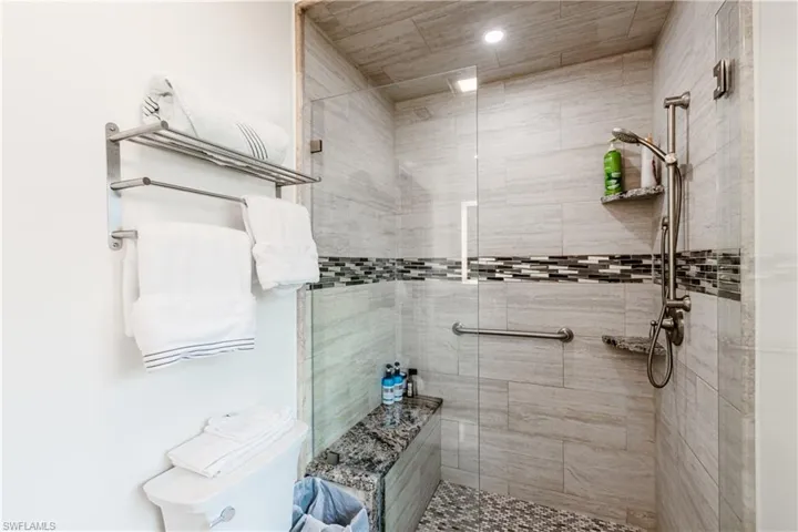 Bathroom with an enclosed shower and toilet