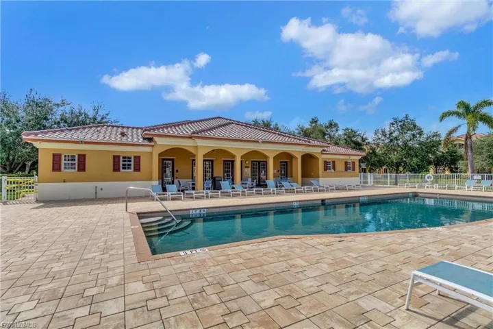 Community pool with a patio