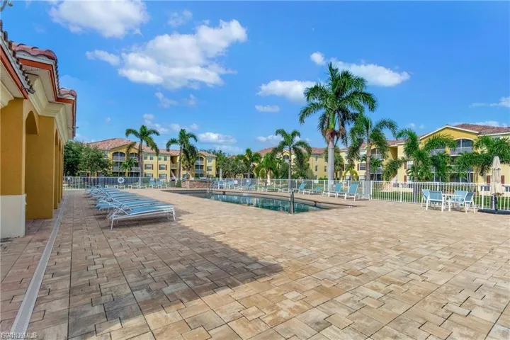 Community pool with a patio area
