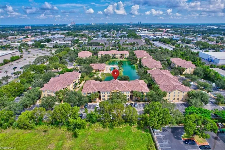Aerial view of property's location with a nearby body of water
