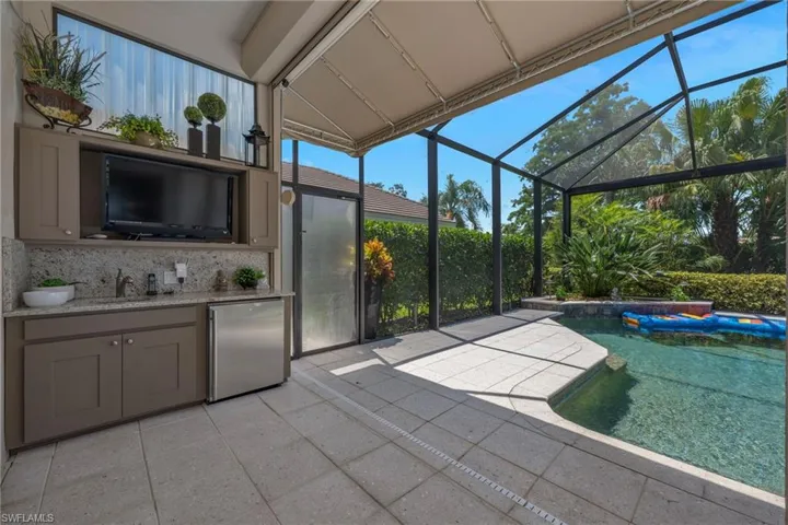 With outdoor kitchen