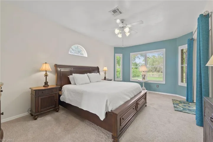 Primary Bedroom with Bay Window and Sliders Out to Lanai.