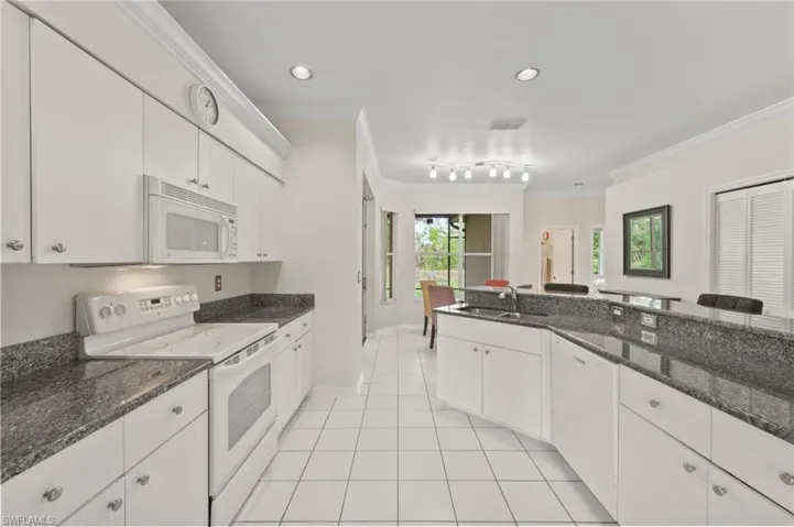 Kitchen w Granite Counters and Breakfast Bar