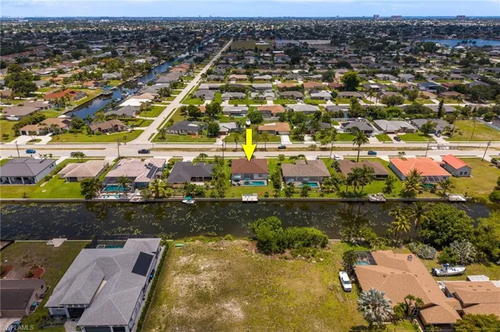 Aerial perspective showcasing a residential property with a private pool