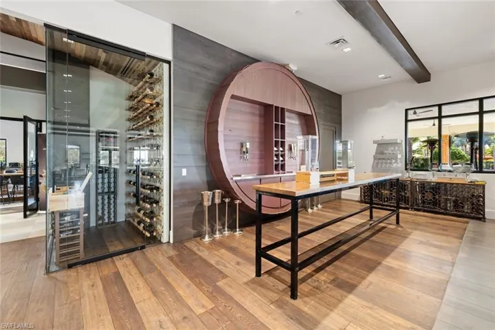Clubhouse Dining room featuring beam ceiling and light hardwood / wood-style flooring