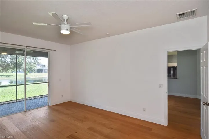 This spacious Primary Suite has glass sliders that lead to the  Lanai