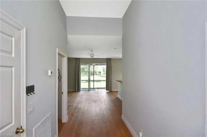 Enter this beautifully updated home With newly installed wood flooring throughout