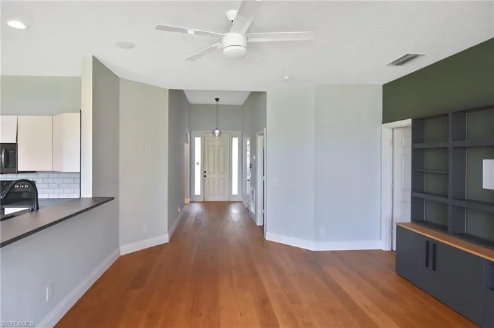 The built in wall unit offers additional storage space as well as a special feature in the Great Room