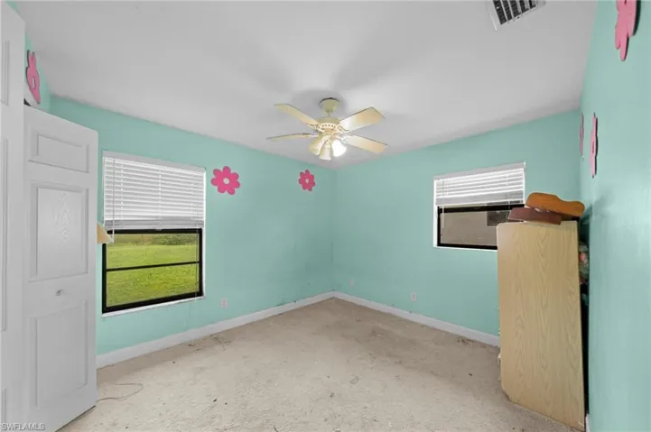 Unfurnished bedroom with baseboards and a ceiling fan