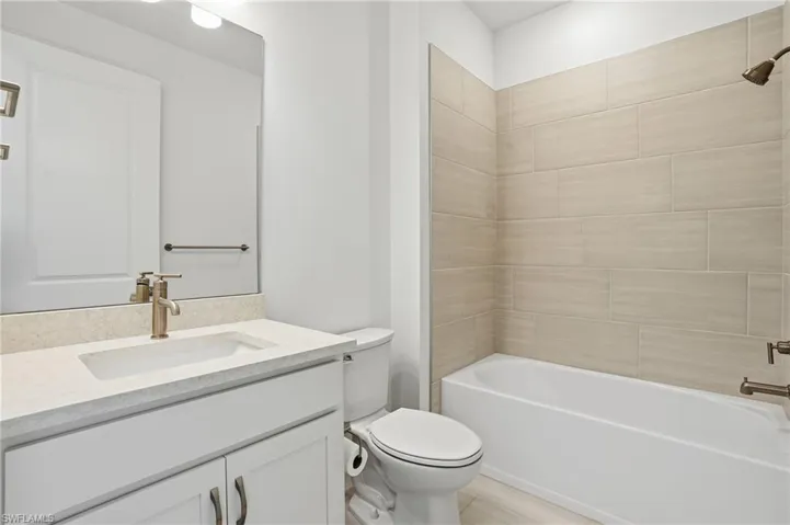 Bathroom featuring vanity and shower / tub combination