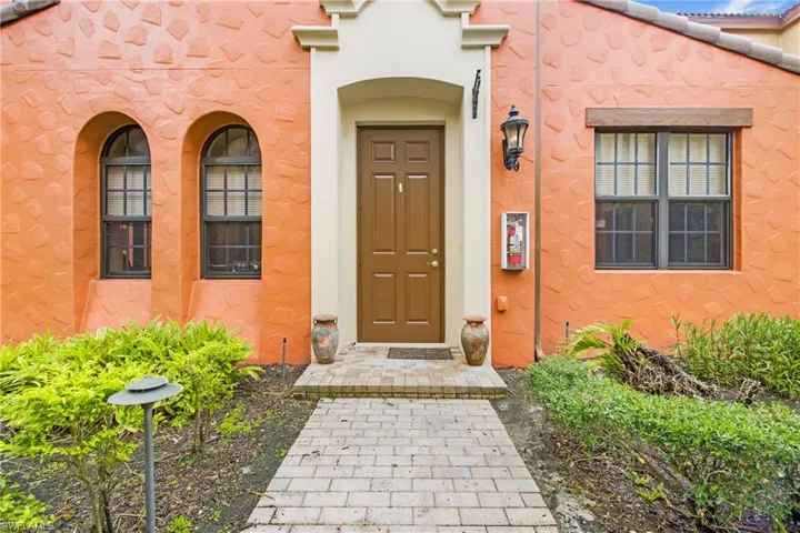 Entrance to property featuring stucco siding