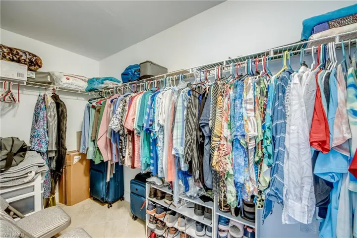 Walk in closet featuring light tile patterned flooring