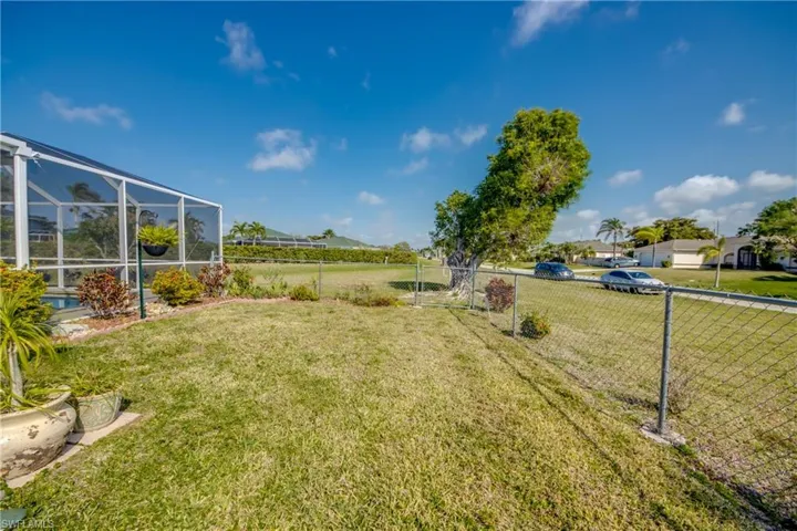 View of yard with a lanai