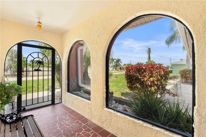 Entrance foyer with a textured wall  Photo virtually enhanced.
