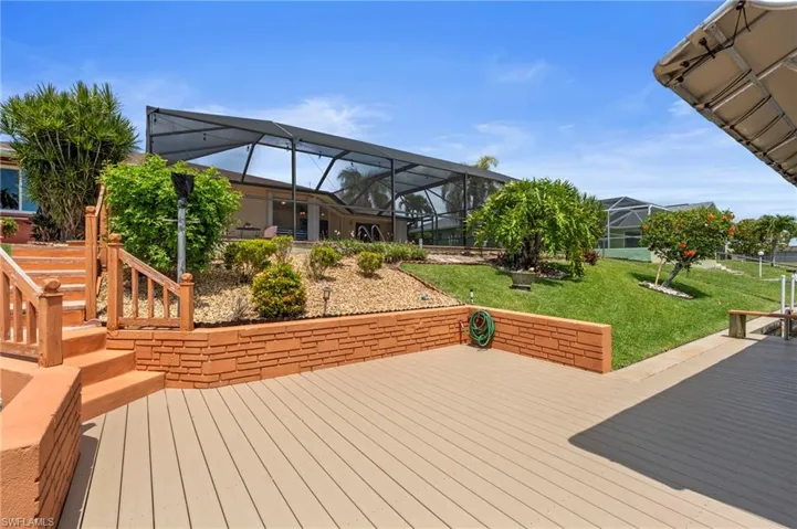 Wooden deck with a lawn  Photo virtually enhanced.