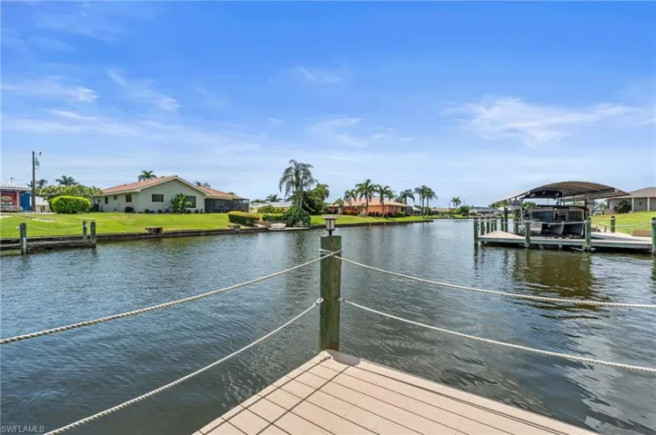 Dock area with a water view and  Photo virtually enhanced.