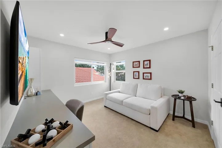 Office area featuring recessed lighting, ceiling fan, and light colored carpet