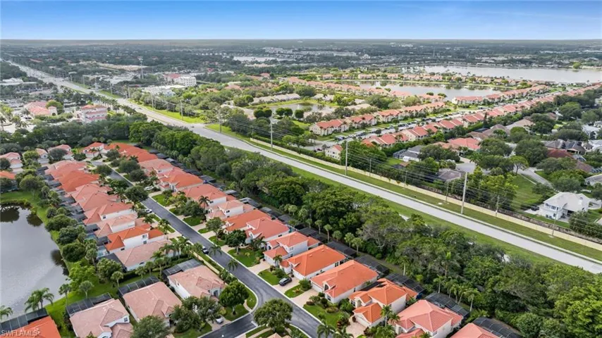 Aerial overview of property's location with nearby suburban area and a nearby body of water
