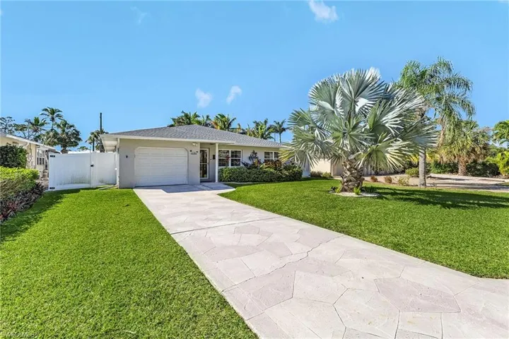 Ranch-style house featuring stucco siding and a fenced in back yard.