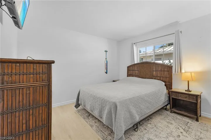 Guest Bedroom featuring light wood-style floors