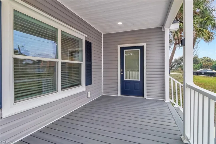 Wooden deck featuring covered porch