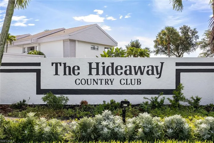Entry monument with "The Hideaway Country Club" lettering