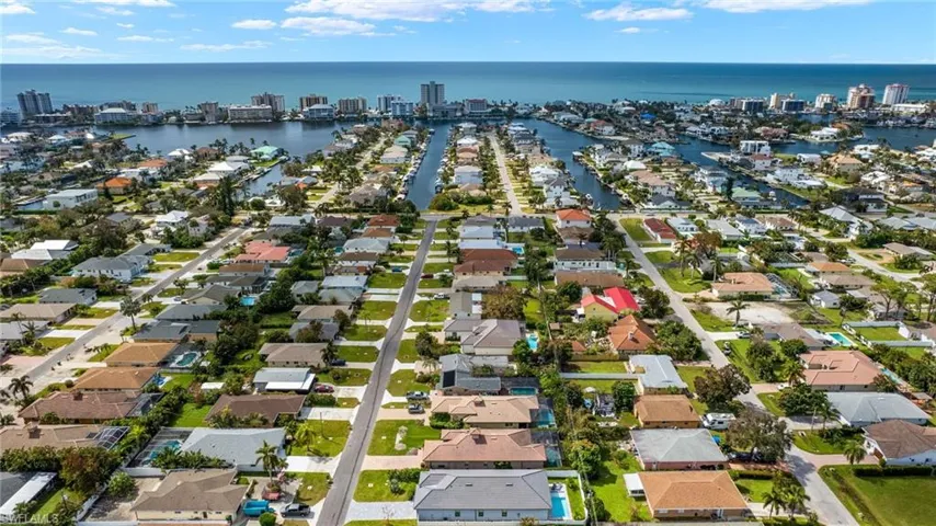 Drone / aerial view featuring a residential view, a city view, and a water view