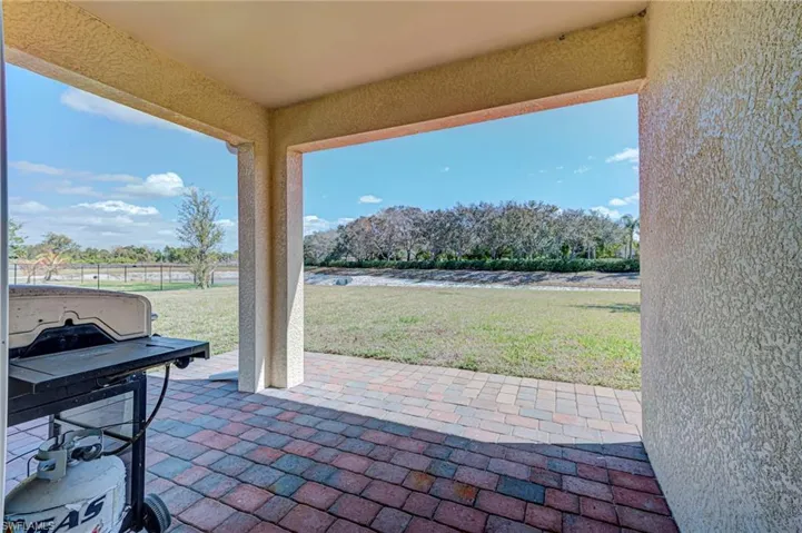 View of patio featuring a grill