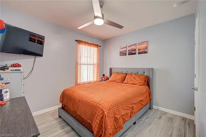 Bedroom featuring light wood-style flooring and ceiling fan