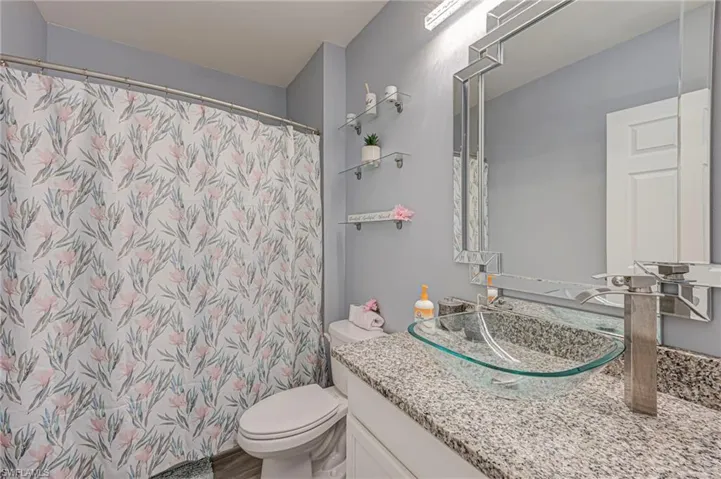 Bathroom featuring vanity and a shower with curtain