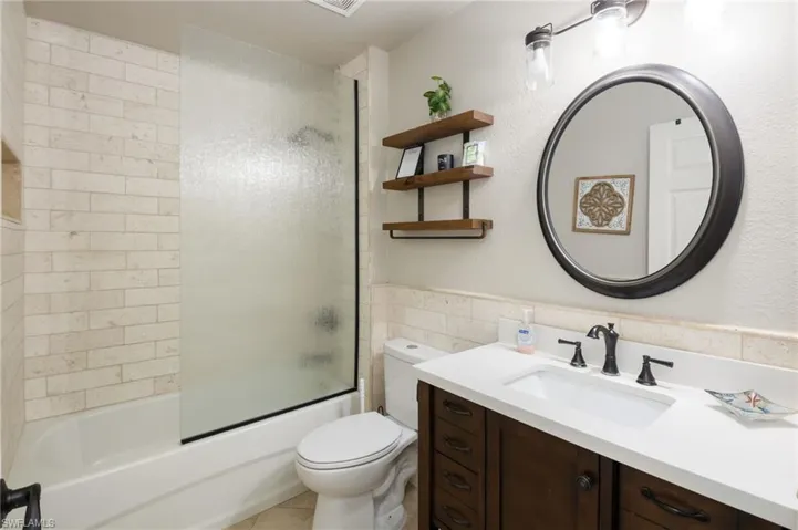 Shower/bath combo in guest rest room.