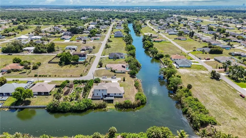 Located on an oversized lot on two intersecting freshwater canals.